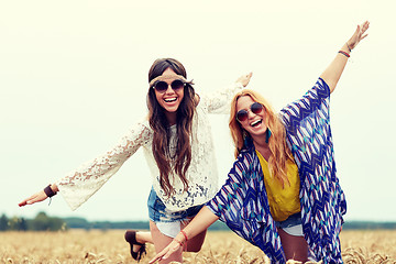 Image showing happy hippie women having fun on cereal field