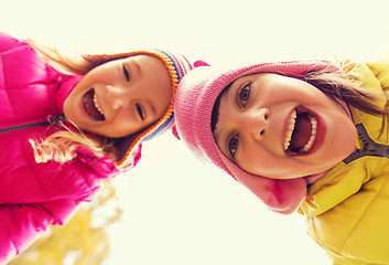 Image showing happy laughing girls faces outdoors