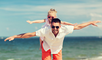 Image showing happy family having fun on summer beach