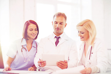 Image showing doctors looking at tablet pc