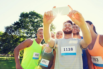 Image showing teenage sportsmen taking selfie with smartphone