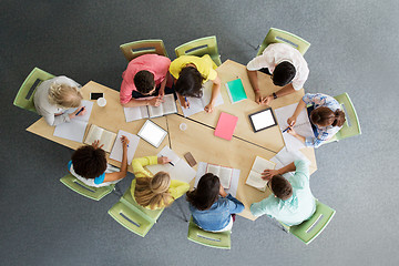 Image showing group of students with tablet pc at school library