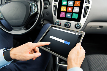 Image showing close up of man with tablet pc in car
