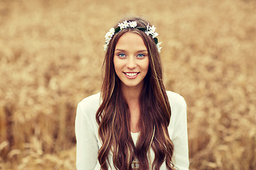 Image showing smiling young hippie woman on cereal field