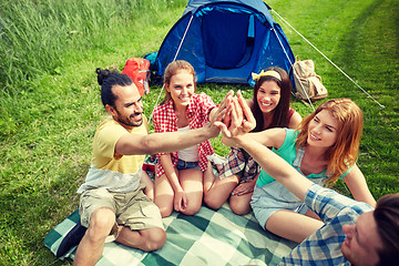 Image showing happy friends making high five at camping