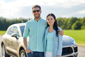 Image showing happy man and woman hugging at car