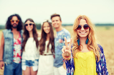 Image showing happy young hippie friends showing peace outdoors