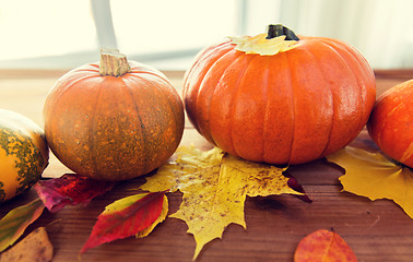 Image showing close up of pumpkins on wooden table at home