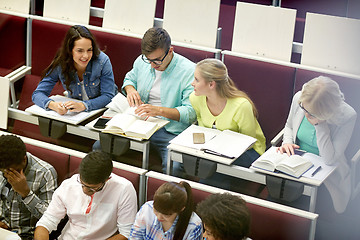 Image showing group of students with notebooks at lecture hall