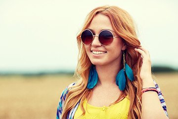 Image showing smiling young redhead hippie woman outdoors