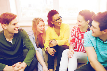 Image showing five smiling teenagers having fun at home