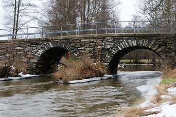 Image showing old stonebridge over the cold water in sweden