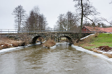 Image showing old stonebridge over the cold water in sweden