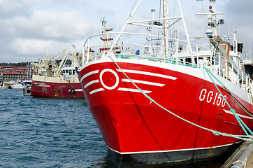 Image showing one red fishing boat in harbour