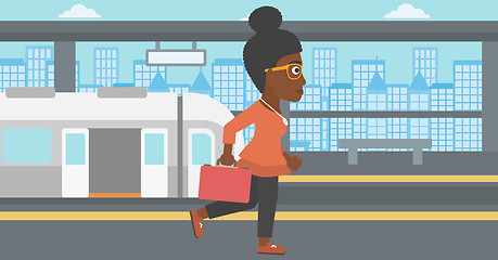 Image showing Woman at the train station vector illustration.