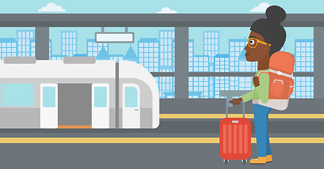 Image showing Woman at the train station vector illustration.