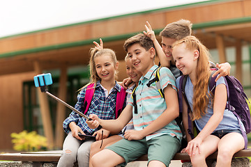 Image showing happy elementary school students taking selfie