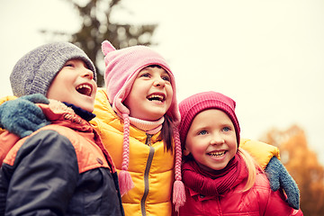 Image showing group of happy children hugging in autumn park