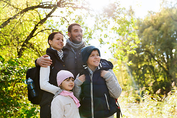 Image showing happy family with backpacks hiking