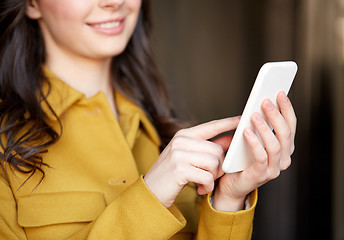 Image showing close up of young woman or girl with smartphone