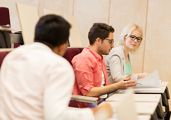 Image showing group of students with notebooks in lecture hall