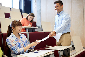 Image showing teacher giving tests to students at lecture