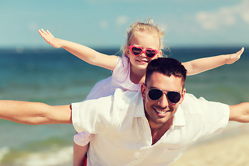 Image showing happy family having fun on summer beach