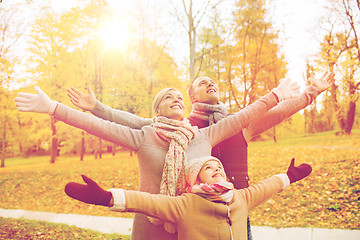 Image showing happy family having fun in autumn park