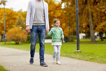 Image showing happy family walking in summer park