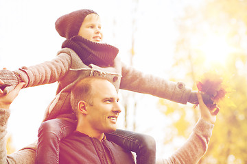 Image showing happy family having fun in autumn park