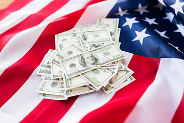 Image showing close up of american flag and dollar cash money