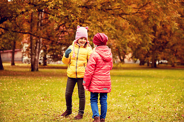 Image showing two happy little girls in autumn park