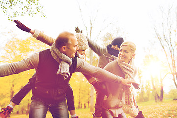 Image showing happy family having fun in autumn park