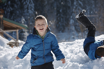 Image showing kids playing with  fresh snow