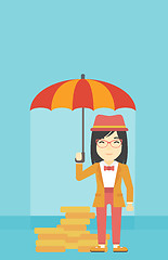 Image showing Business woman with umbrella protecting money.