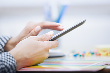 Image showing Woman using digital tablet at office