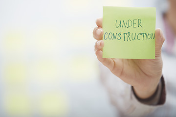 Image showing Under construction text on adhesive note