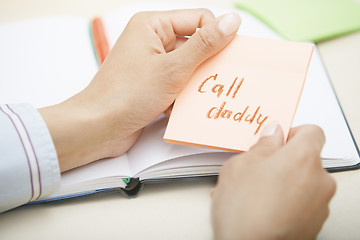 Image showing Call daddy text on adhesive note