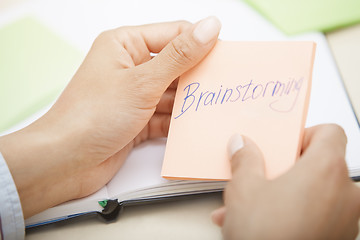 Image showing Brainstorming text on adhesive note