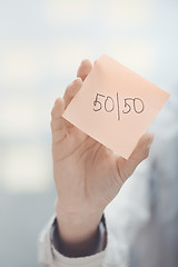 Image showing Fifty-fifty text on adhesive note