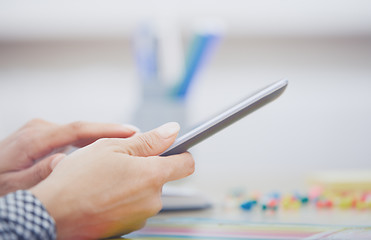 Image showing Woman using digital tablet at office