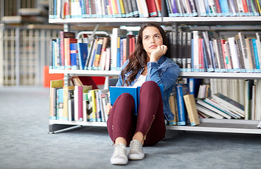 Image showing high school student girl reading book at library