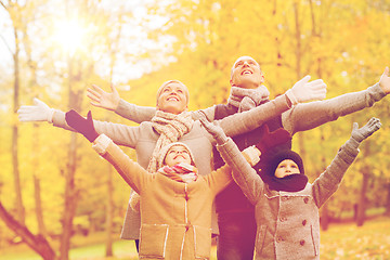 Image showing happy family having fun in autumn park