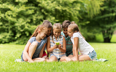 Image showing kids or friends with smartphone in summer park