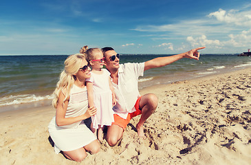 Image showing happy family in sunglasses on summer beach