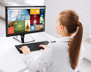 Image showing businesswoman with internet page on computer