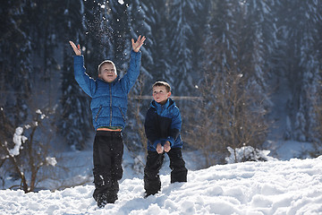 Image showing kids playing with  fresh snow