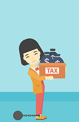 Image showing Chained business woman with bags full of taxes.