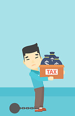 Image showing Chained businessman with bags full of taxes.