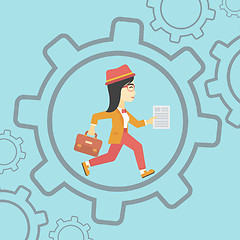 Image showing Business woman running inside the gear.